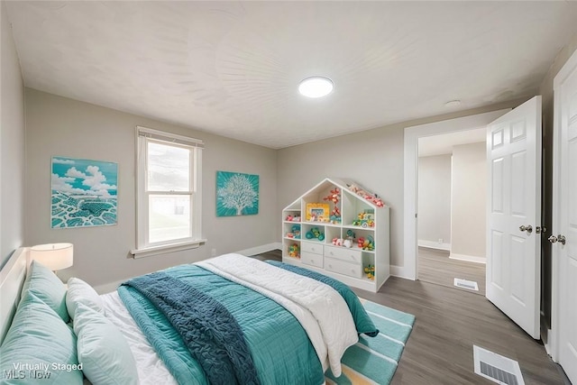 bedroom featuring dark hardwood / wood-style flooring