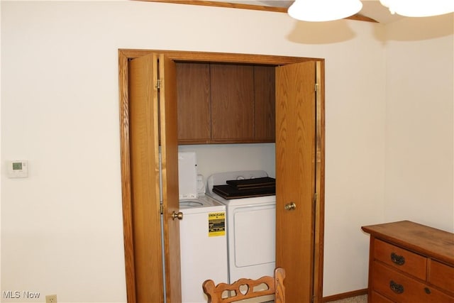 laundry area with cabinets, ceiling fan, and washing machine and dryer