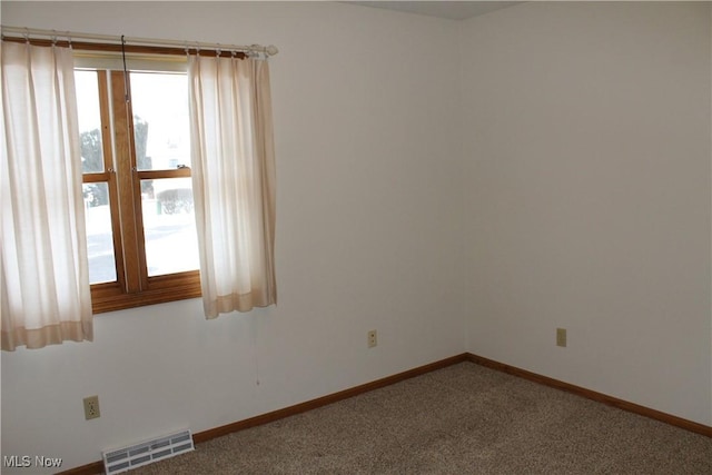 unfurnished room with carpet floors