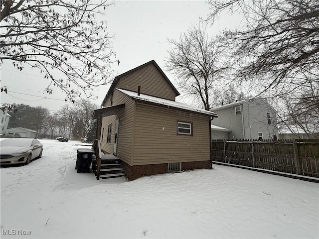 view of snow covered house