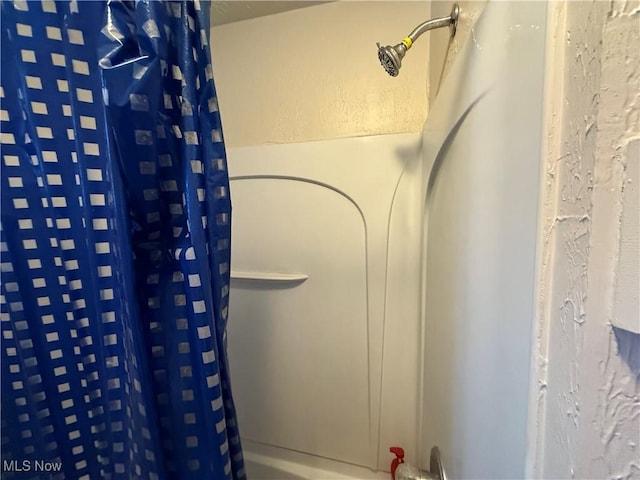 bathroom with a shower with shower curtain