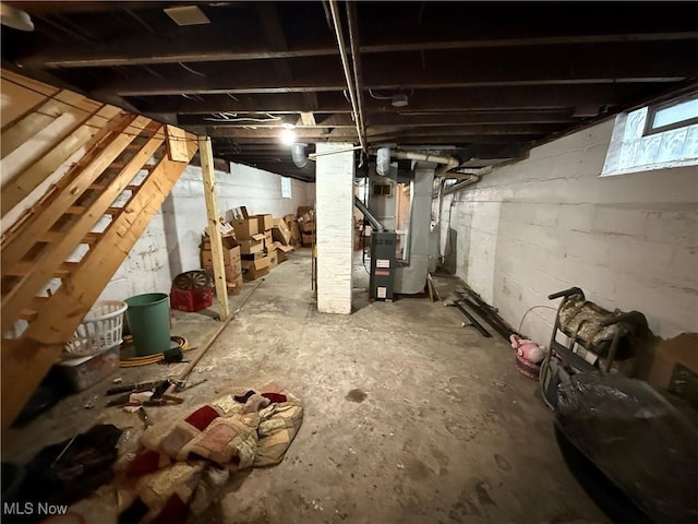 basement featuring heating unit