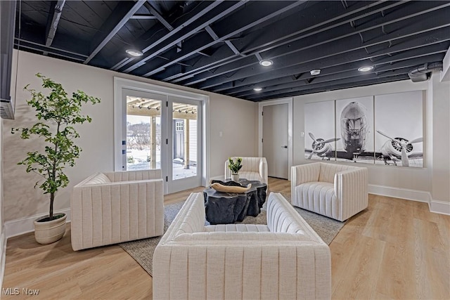 living room with hardwood / wood-style flooring and french doors