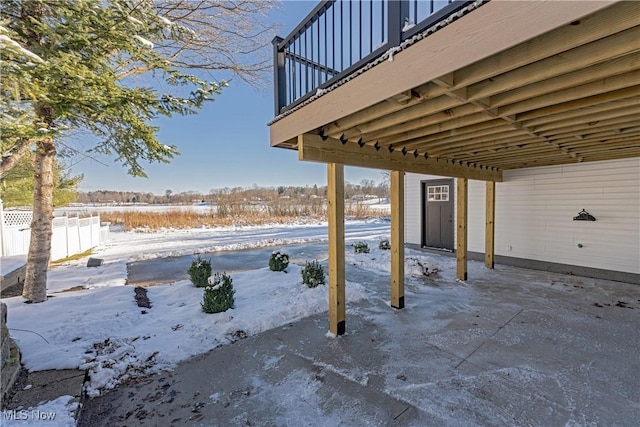 view of snow covered patio