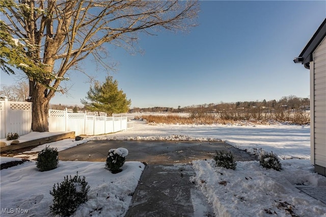 view of yard covered in snow