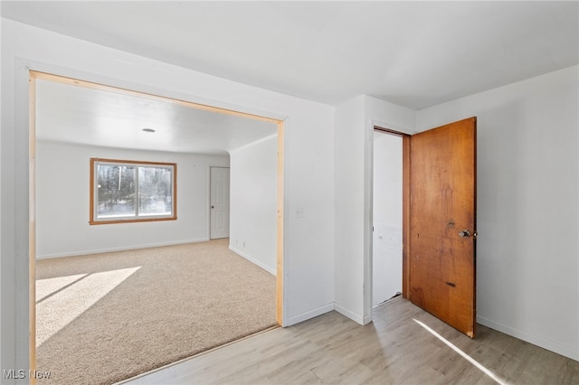 empty room with light colored carpet