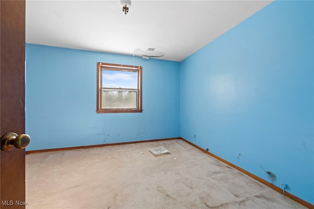 empty room featuring light colored carpet