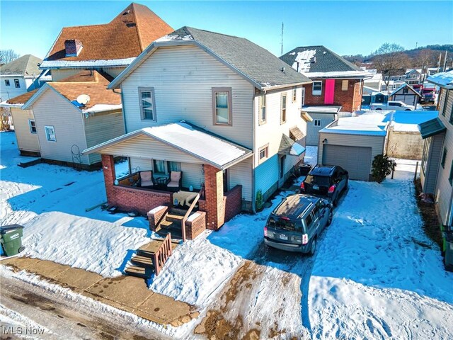 view of snow covered house