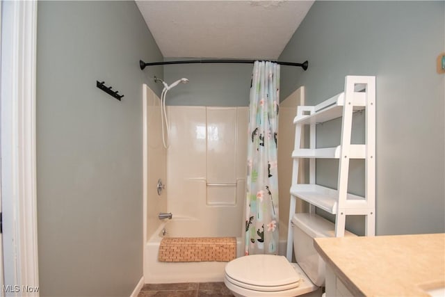 bathroom with vanity, tile patterned floors, toilet, and shower / bath combo