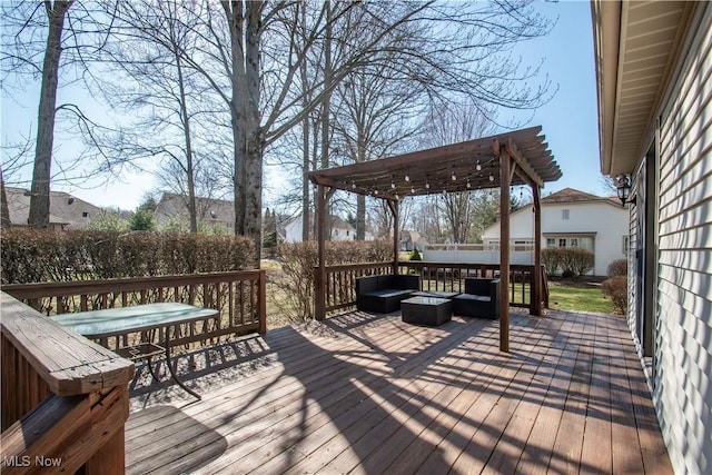 wooden terrace featuring an outdoor living space and outdoor dining area