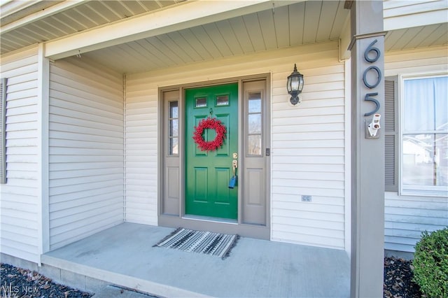 doorway to property with a porch