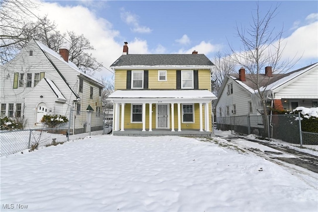 colonial inspired home featuring covered porch