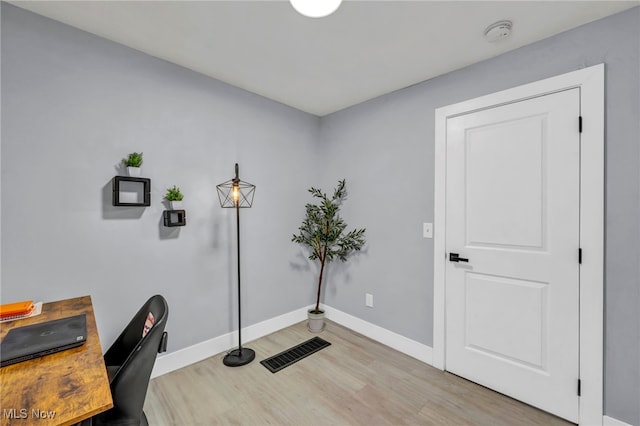 office with wood-type flooring