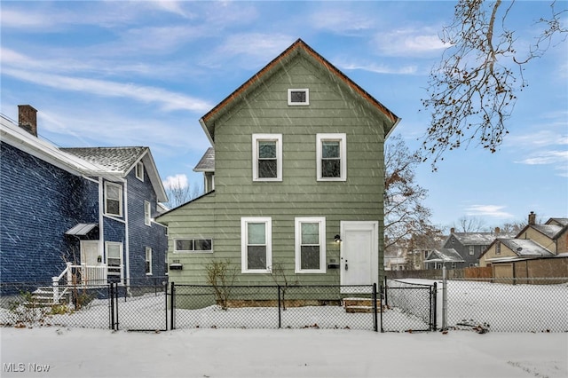 view of snow covered house