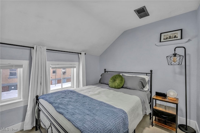 bedroom with vaulted ceiling