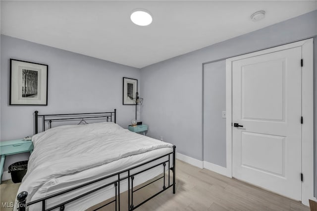 bedroom featuring light wood-type flooring