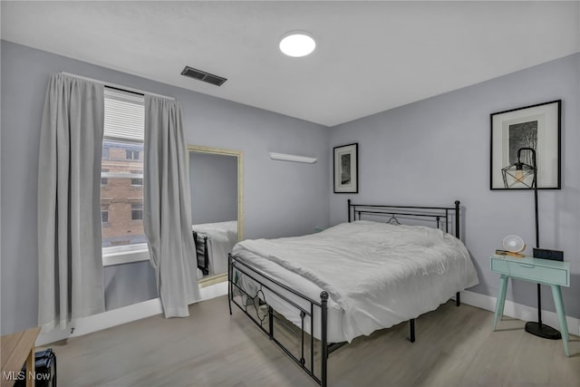 bedroom with light wood-type flooring