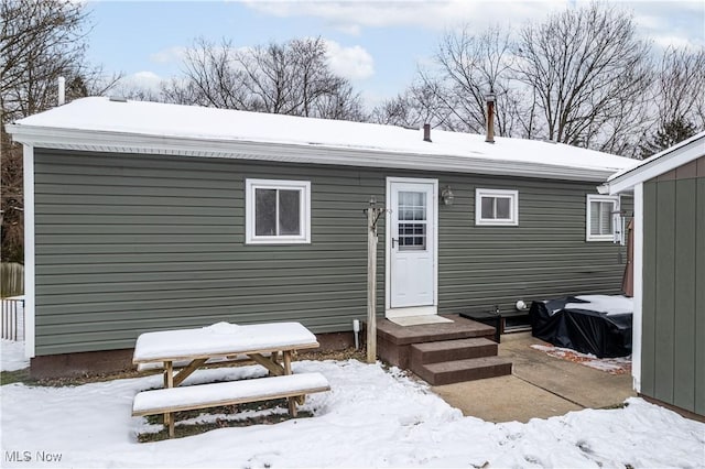 view of snow covered house