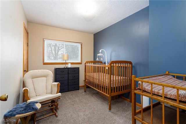 carpeted bedroom featuring a textured ceiling