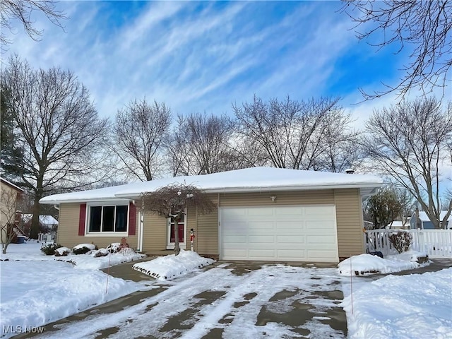 single story home featuring a garage