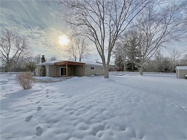 view of yard layered in snow