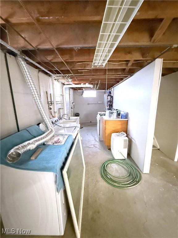 basement with washer and clothes dryer