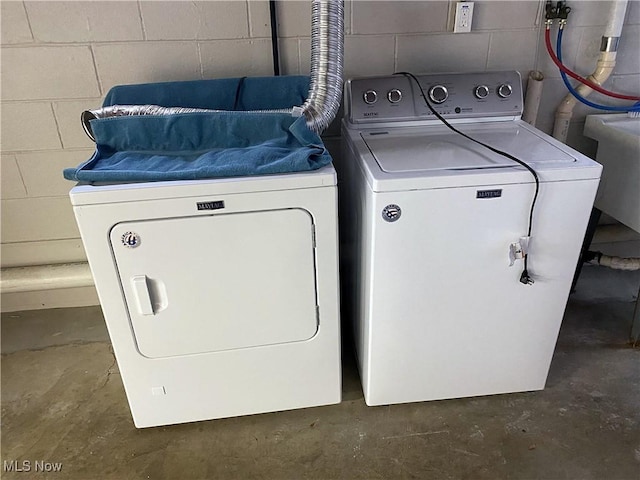 laundry area featuring washing machine and clothes dryer