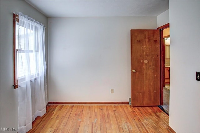 unfurnished room featuring light hardwood / wood-style floors