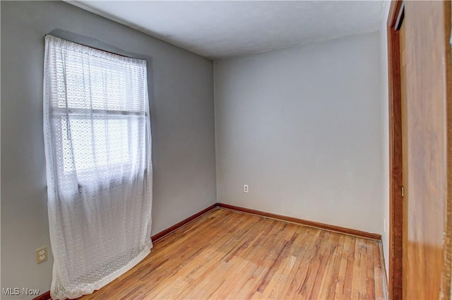 spare room with light wood-type flooring