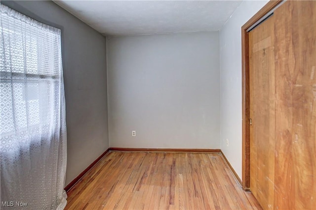 spare room featuring light hardwood / wood-style floors