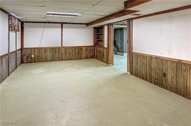 basement featuring a paneled ceiling