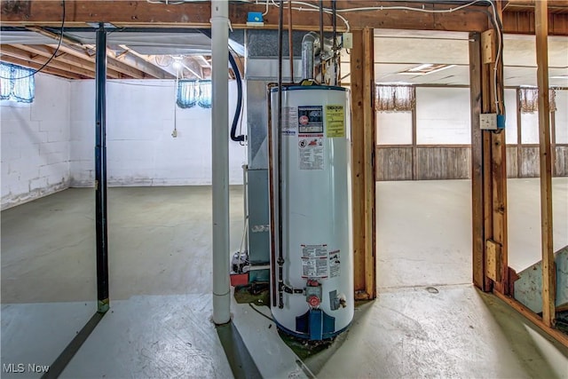 utility room featuring water heater