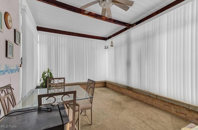 sunroom with beamed ceiling and ceiling fan