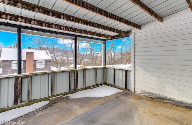 unfurnished sunroom with a wealth of natural light