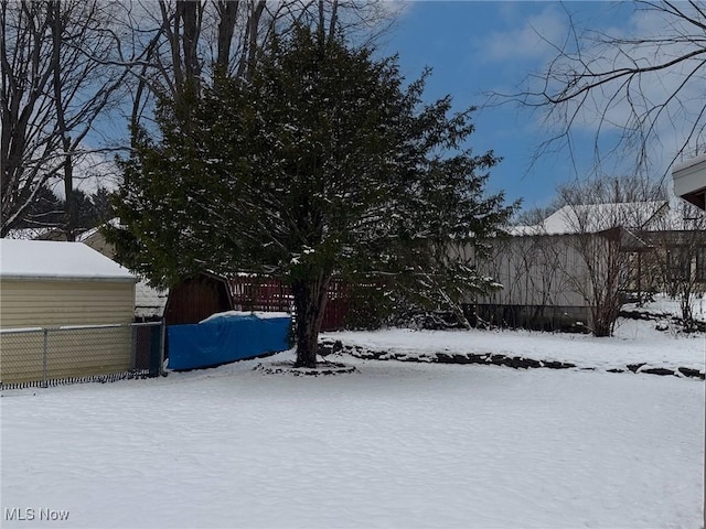 view of yard covered in snow