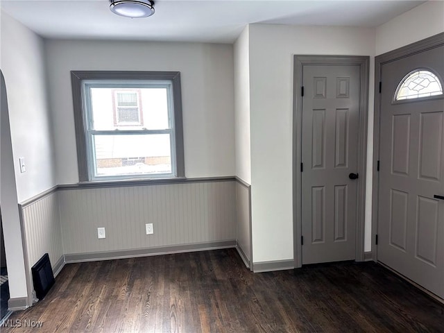 entrance foyer with dark hardwood / wood-style flooring