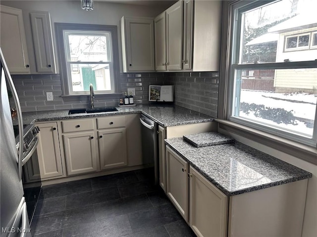 kitchen with backsplash, plenty of natural light, and sink