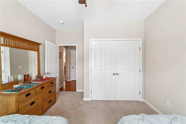 carpeted bedroom featuring a closet