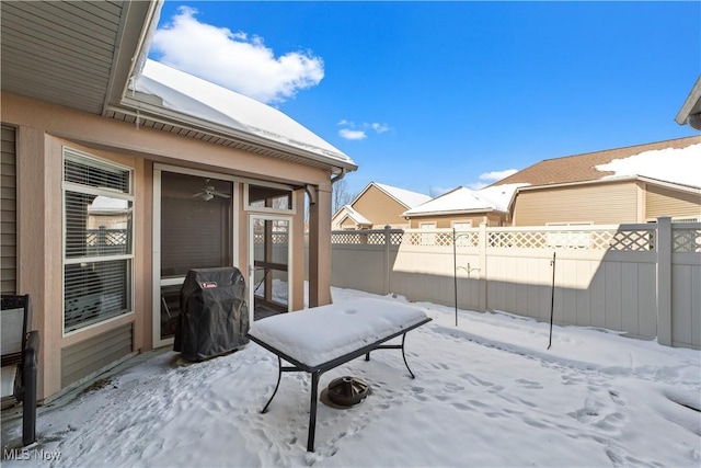 view of yard layered in snow