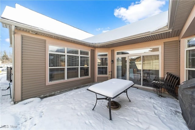 view of snow covered patio