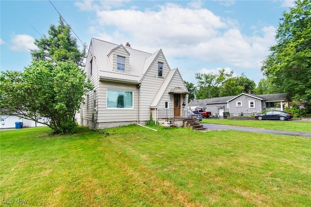 cape cod-style house with a front yard