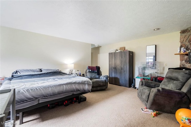 carpeted bedroom featuring a textured ceiling