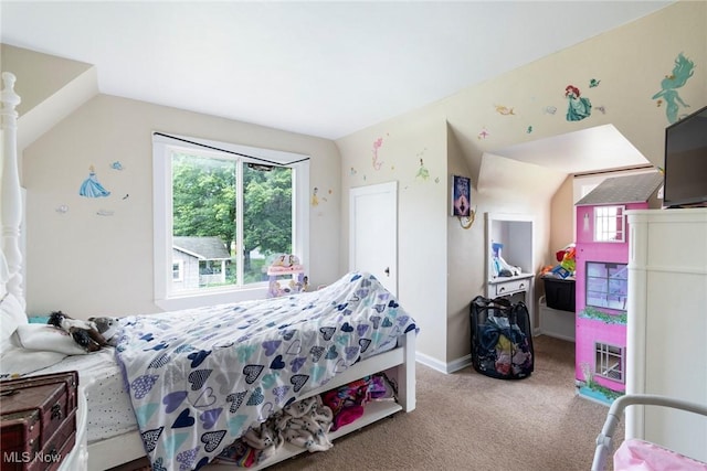 carpeted bedroom with lofted ceiling