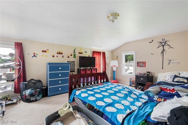 carpeted bedroom with vaulted ceiling