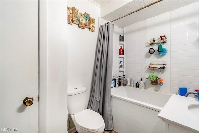 full bathroom with shower / bathtub combination with curtain, vanity, a textured ceiling, and toilet