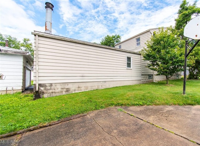 view of property exterior with a lawn