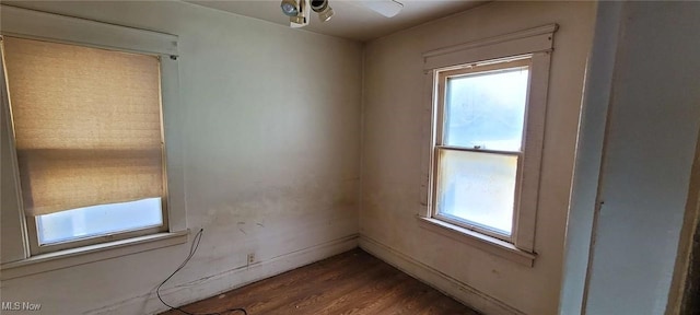 unfurnished room featuring ceiling fan and hardwood / wood-style floors