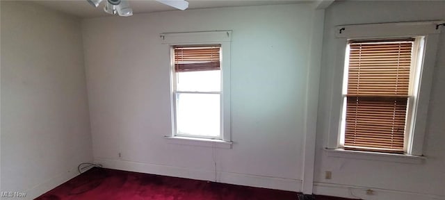 unfurnished room with ceiling fan