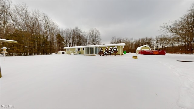 view of yard layered in snow