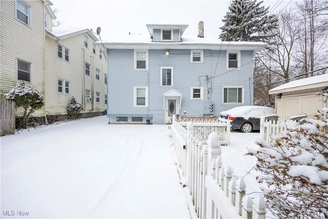 view of snow covered house